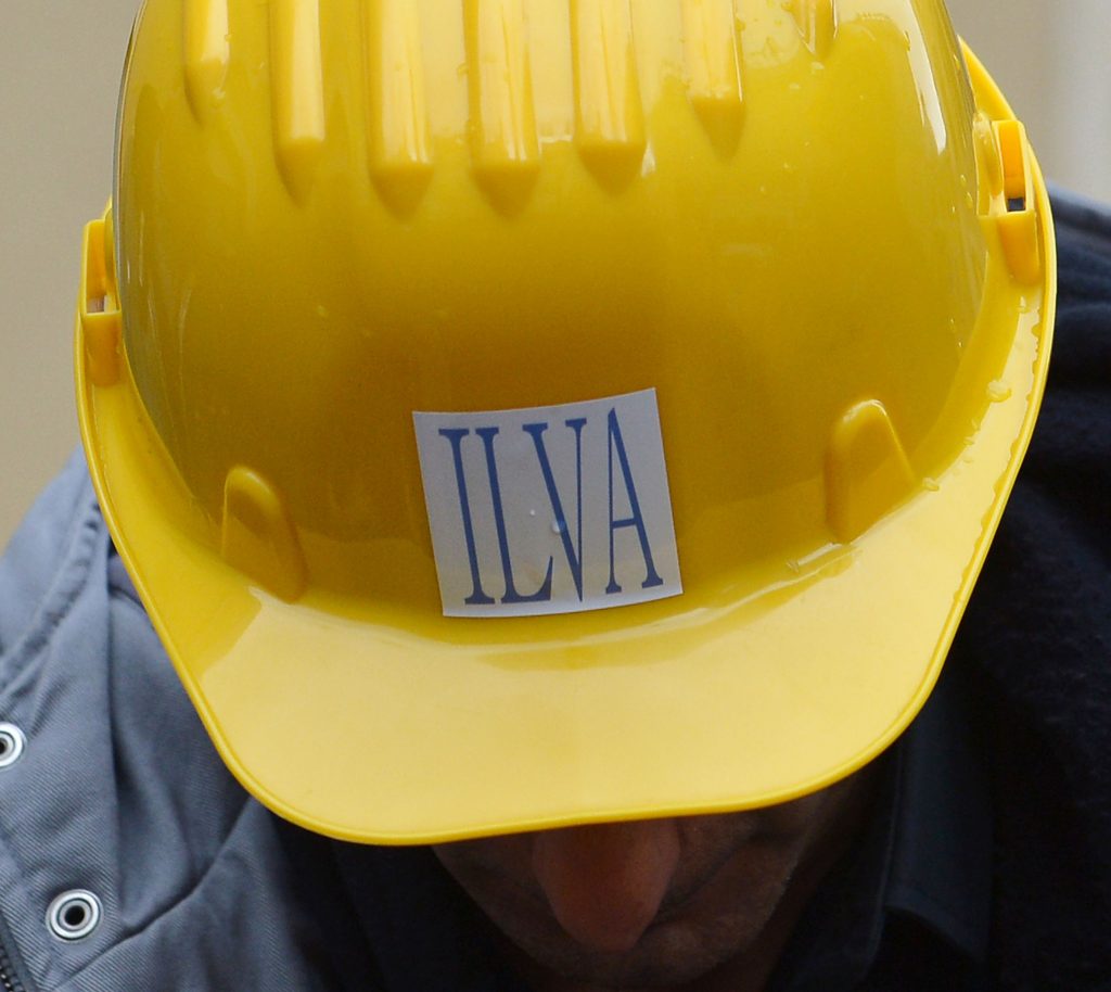 A worker of the Ilva Genova steelworks takes part in a demonstration in Rome, on November 29, 2012. Workers demonstrated against the closure of the factory decided by the head of the company, after the arrests of leaders and the seizure of the Taranto. AFP PHOTO / ALBERTO PIZZOLI